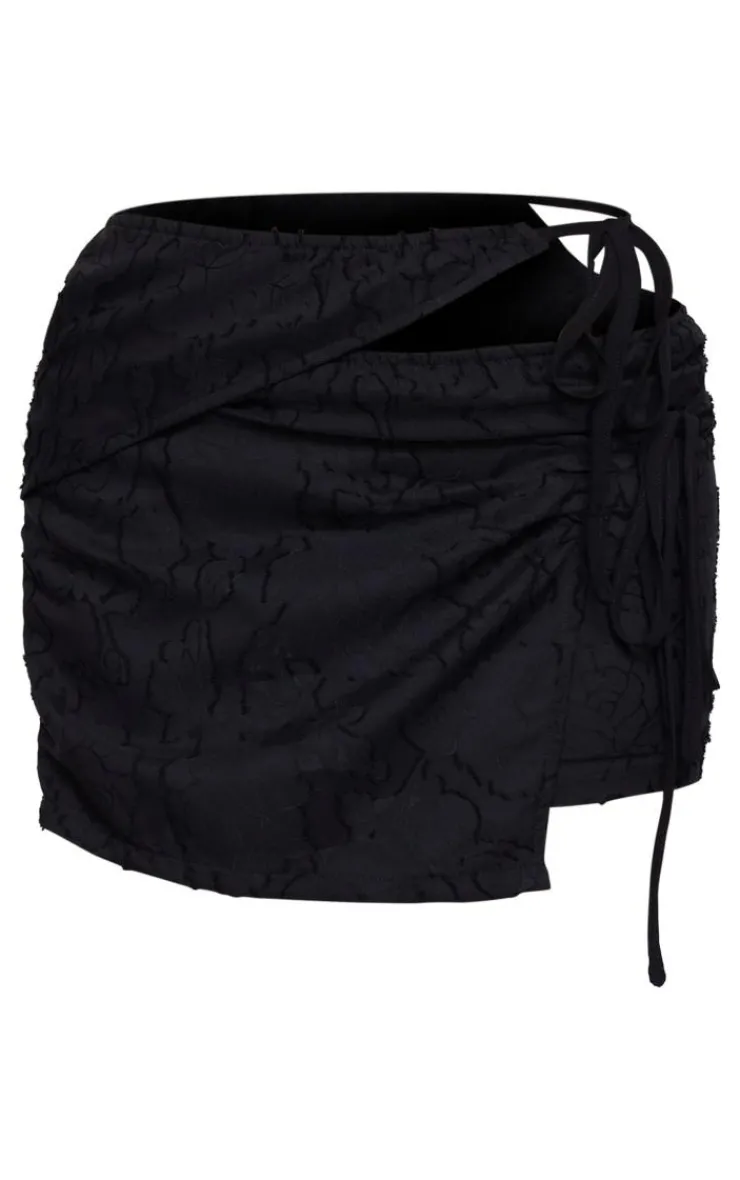 Online PrettyLittleThing Floral Applique Cut Out Wrap Over Micro Mini Skirt Black