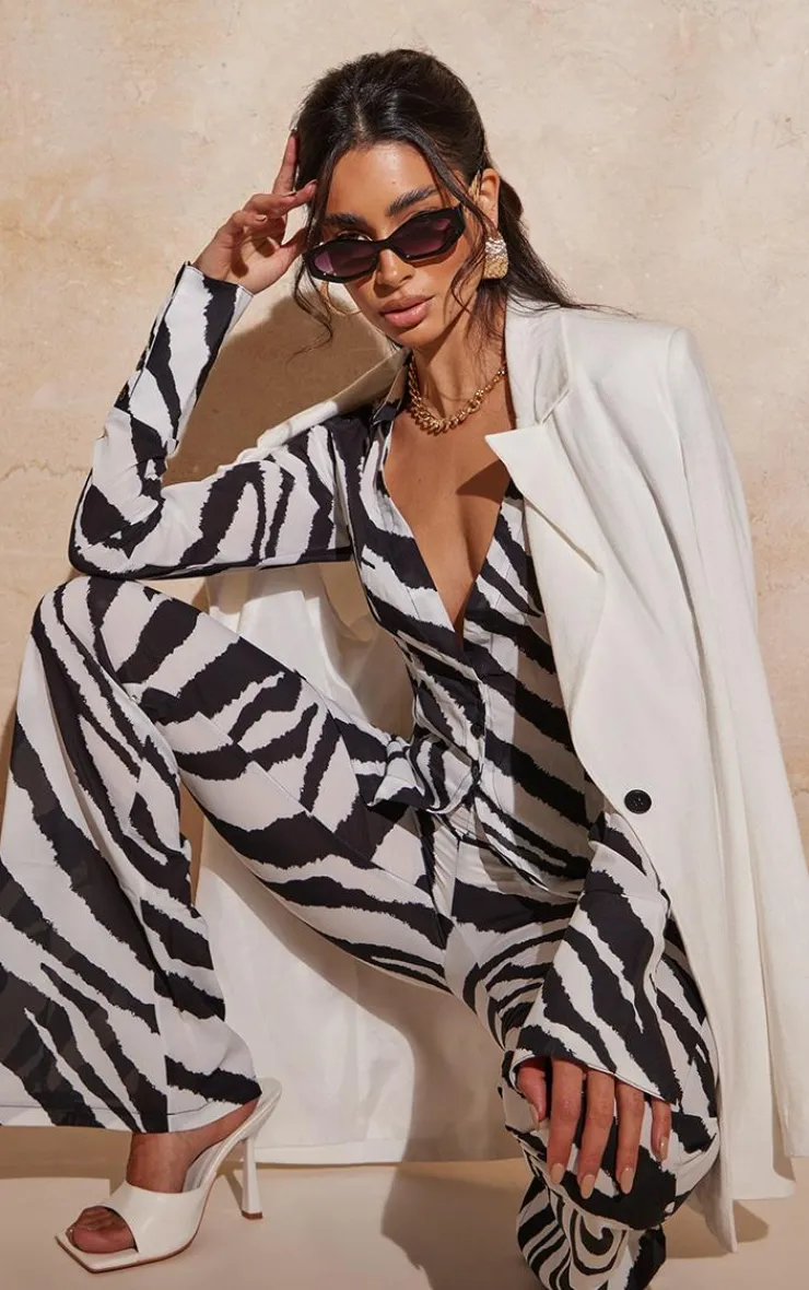 Online PrettyLittleThing Zebra Print Chiffon Flare Pants Black