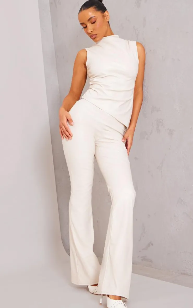 Online PrettyLittleThing Faux Leather High Neck Asymmetric Hem Side Ruched Top Cream