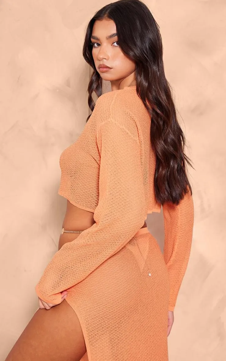 Online PrettyLittleThing Textured Sheer Knit Floaty Long Sleeve Crop Top Orange