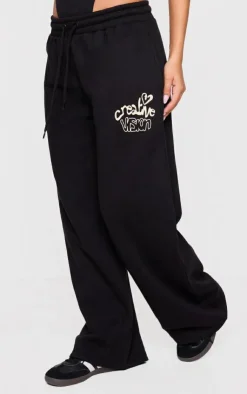 Hot PrettyLittleThing Petite Graphic Detail Wide Leg Sweatpants Black