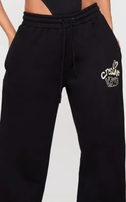 Hot PrettyLittleThing Petite Graphic Detail Wide Leg Sweatpants Black