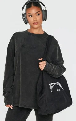 PrettyLittleThing Embossed Logo Washed Long Sleeve T-shirt Black