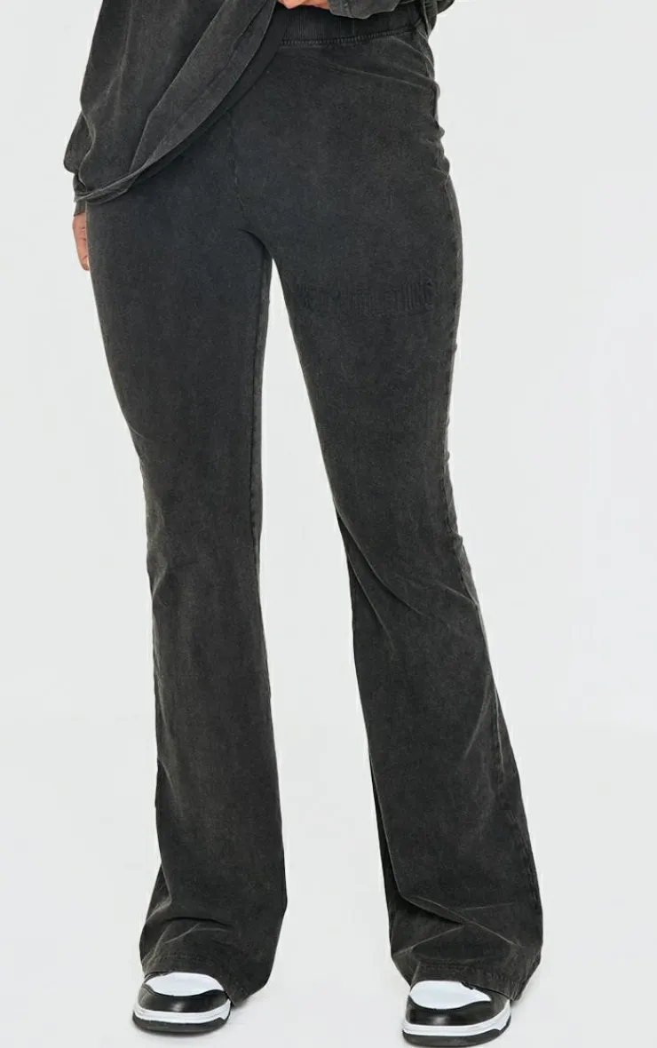 PrettyLittleThing Embossed Logo Washed Skinny Flare Pants Black