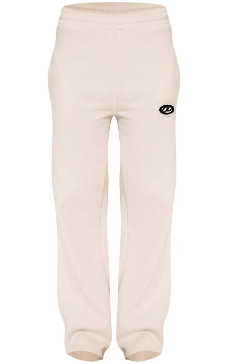 Online PrettyLittleThing Contrast Logo Badge Wide Leg Sweatpants Cream